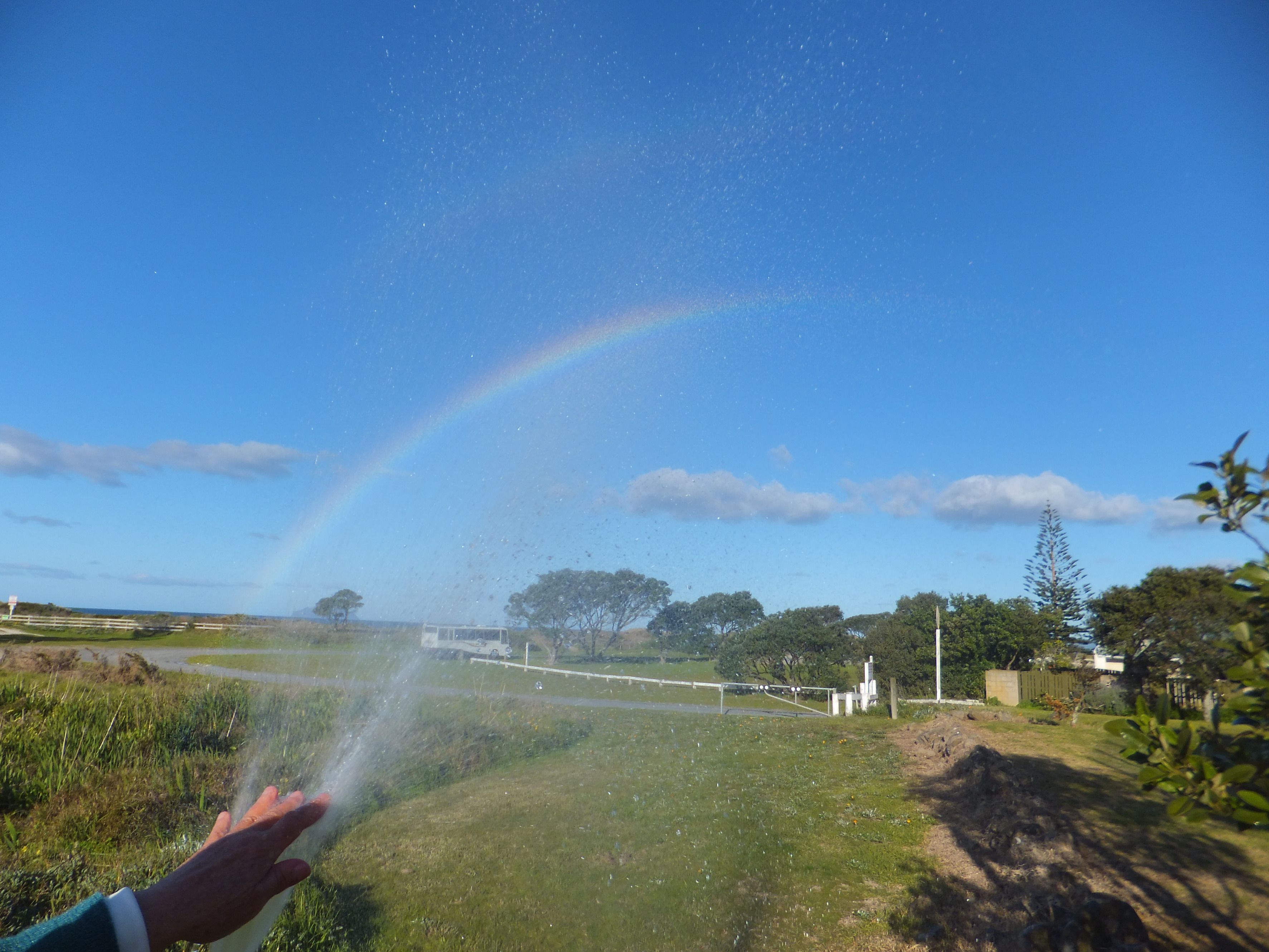 Aroha's rainbow showing in water mist 2/33