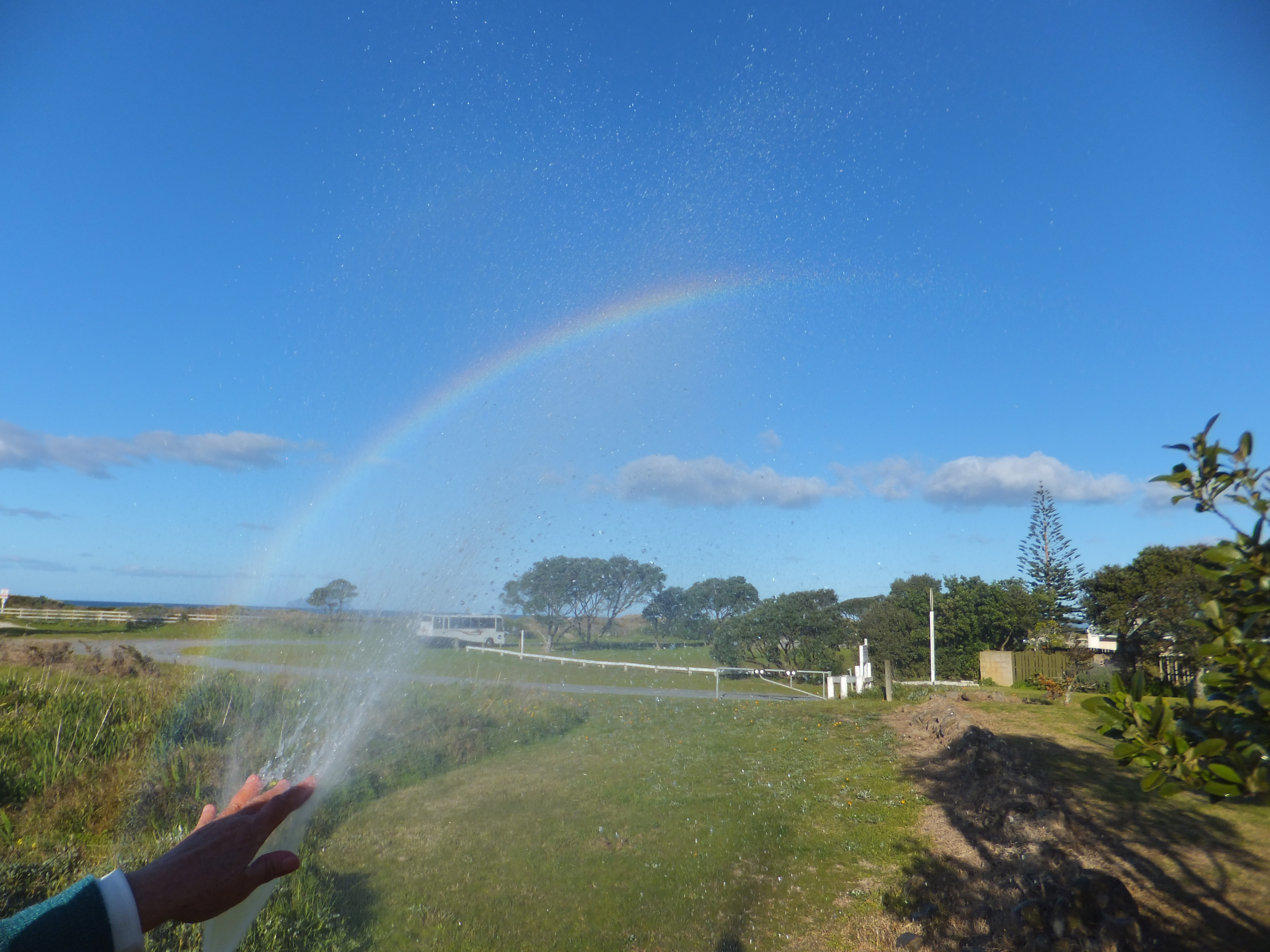 Aroha's rainbow showing in water mist 6/34