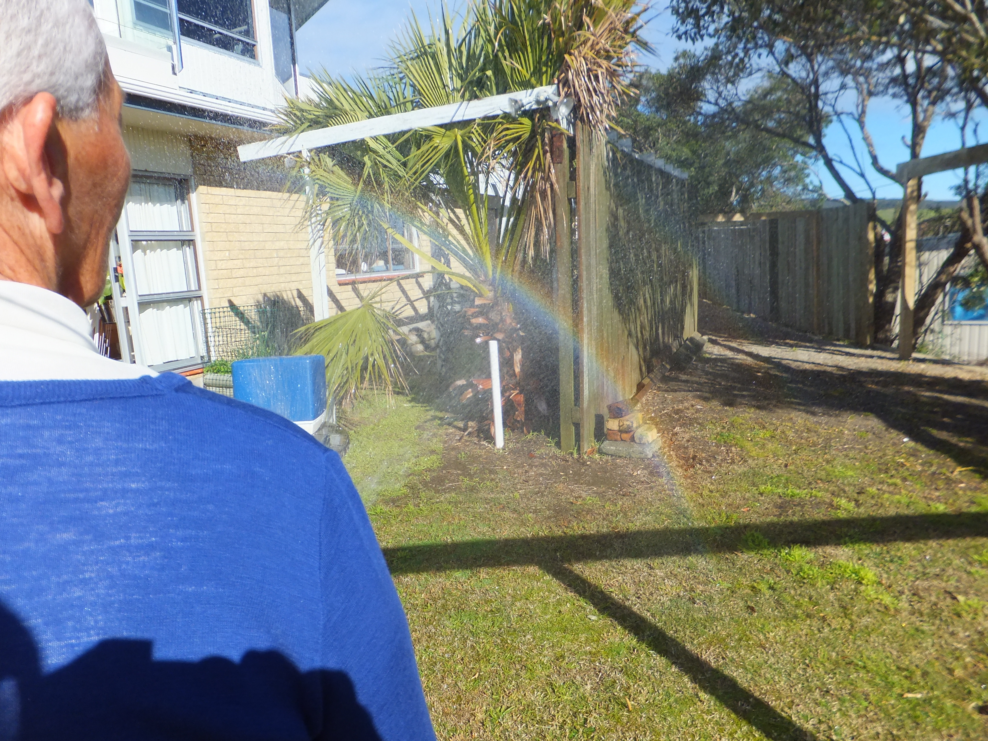 Aroha's rainbow showing in water mist 8/63